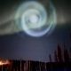 The glow of a mysterious spiral light in the Alaskan sky
